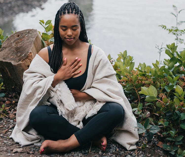 close up shot of a woman meditating
